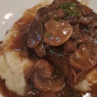 Braised Short Ribs · Served With Garlic Mashed Potato, Sautéed Mushrooms, and Red Wine Reduction.