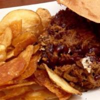 Pulled Pork Sandwich · House-Rubbed, Smoked Slow 'N' Low, Served With A Side Creamy Coleslaw.