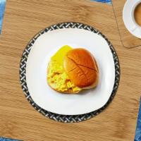 Meaty Superior Sandwich · Scrambled egg, choice of meat, cheddar cheese and served with your choice of bread.