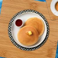 Buttermilk Pancakes · Fluffy pancakes cooked with care and love served with butter and maple syrup. Served in pairs.