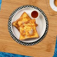 French Toast · Fresh bread battered in egg, milk, and cinnamon cooked until spongy and golden brown. Topped...