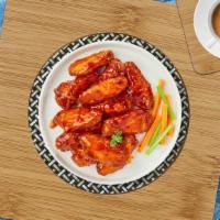 Red Buffed Chicken Wings · (5 pieces) Fresh chicken wings breaded, fried until golden brown, and tossed in buffalo sauce.