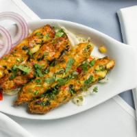 Chicken Seekh Kabab · Minced chicken with onions, herbs, and spices.