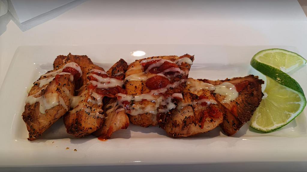 Chicken Tikka Kabab · Chunks of white meat marinated with freshly ground spices.