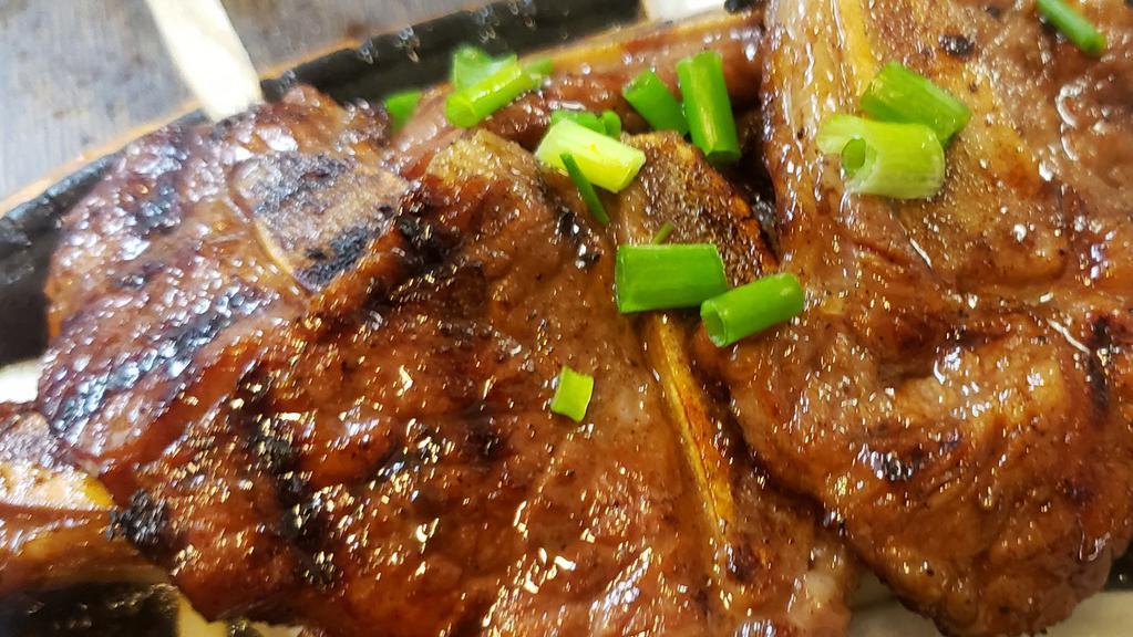 Kal-Bi / 엘에이 갈비 · BBQ beef short ribs marinated with soy sauce based signature sauce. Served with Kim chee, ban Chan ( vegetables ) and white rice.