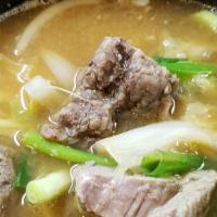 Short Rib & Cabbage Soup / 우거지갈비탕 · Ugeoji Kalbi tang / tender beef short rib and cabbage soup.
served with Kim chee, ban Chan (...