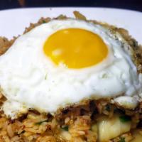 Kim Chee Fried Rice / 김치볶음밥 · Stir-fried white rice with Kim Chee and sunny side up eggs.