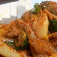 Stir-Fried Kim Chee & Spicy Pork / 김치제육볶음 · Kim Chee Jeiyook Bohk Eum / stir-fried Kim Chee and spicy pork with cold sliced tofu.
served...