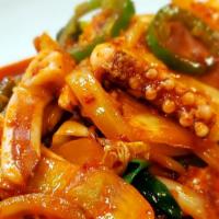 Stir-Fried Squid / 오징어볶음 · Ohjinguh Bohk Eum / stir-fried squid and vegetables with spicy sauce.
served with Kim chee, ...