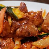 Stir-Fried Chicken / 닭볶음 · Dak Bohk Eum / stir-fried chicken tights and vegetables with spicy sauce.
served with Kim ch...
