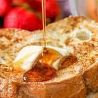 French It Up Toast · Classic French toast topped with organic maple syrup, powder sugar.