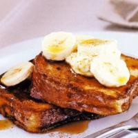 Banana Glaze French Toast · Classic French toast topped with freshly sliced banana, organic maple syrup and whipped cream.