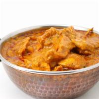 Curry Chicken · Delicious chicken stewed in an onion and tomato based sauce, flavored with ginger, garlic, t...