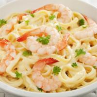 Seafood Fettuccine Alfredo · An aromatic pasta dish consisting of fettuccine with butter, Parmesan cheese, cream, various...