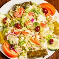 Greek Salad · Iceberg lettuce, romaine lettuce, red onion, green peppers, tomatoes, cucumbers and feta che...