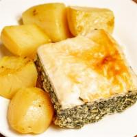 Spanakopita · Flaky phyllo sheets layered with a savory spinach and feta cheese filling. Served with lemon...