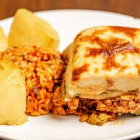 Moussaka · Casserole made by layering eggplant, potatoes and zucchini with a spiced meat filling, toppe...