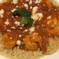 Shrimp Ala Santorini · Pan-seared shrimp with fresh tomatoes and feta cheese cooked in marinara sauce. Served over ...