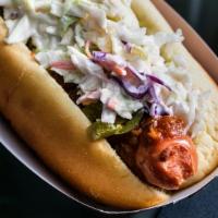 Spicy Redneck · Bacon-wrapped Crif Dog, chili, cole slaw, and pickled jalapeños.