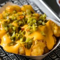 East Village Tots · Cheese sauce, pickled jalapeños.