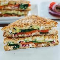Veggie Grilled Cheese · Melted cheddar cheese, ripe avocado, tomato, grilled onions, roasted red peppers, and mayo b...