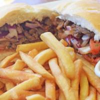 Pan Con Lomo
 · Steak Strips sautéed with onions, tomato and cilantro sandwich, served with French Fries OR ...