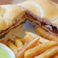 Pan Con Milanesa De Pollo
 · Breaded chicken sandwich with lettuce, tomato and mayo, served with French Fries OR Sweet Po...