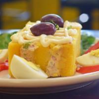 Causa Rellena De Atun · Savory mashed potato layered with tuna veggie salad.