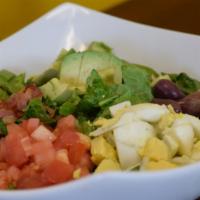 Ensalada Cobb · Cobb salad- Chopped Romaine lettuce with Chopped Hard boiled egg, diced tomatoes, kalamata o...