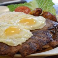 Bistec A Lo Pobre · Grilled Steak Filet topped w/ 2 Fried Eggs, served over French Fries, White rice & Sweet Pla...