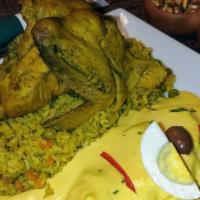 Arroz C/ Pollo C/ Papa A La Huancaina · Cilantro Chicken & Rice served with Potatoes topped w/ Huancaina sauce