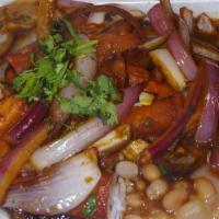 Bistec Encebollado C/ Frijoles Y Arroz · Grilled Steak Filet topped w/ sauteed onions, tomatoes & cilantro, served over Beans & White...