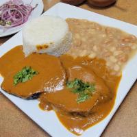 Asado De Res C/ Frijoles Y Arroz · Peruvian Roast Beef served over Beans and White rice. Served with side of Sarza Criolla