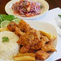 Chicharron De Pescado · Fried Fish Chunks served with Fried Yucas, White rice and side of Sarza