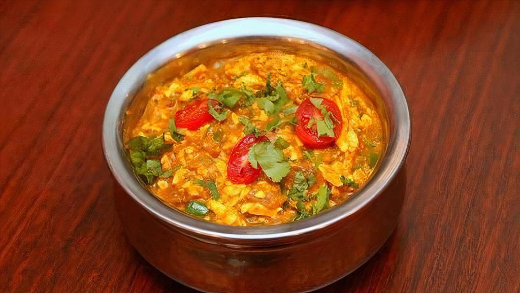 Paneer Burji · Grated cheese cooked with chopped onion, tomatoes, and garam masala.