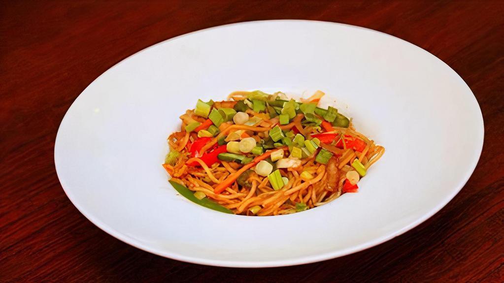 Hakka Noodles · Traditional Hakka style noodles with soy sauce and choice of vegetable and chicken.