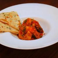 Goan Shrimp Curry · Shrimp simmered in a coastal style sauce with coconut and ground spices.