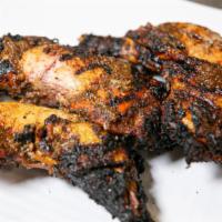 Jerk Quarters Combo · Moist leg and thigh soaked and smoked in our signature jerk marinade and seasoning. Comes wi...