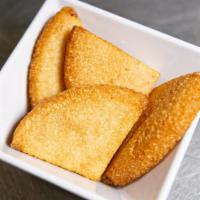 Bammy · Cassava cakes crispy on the outside soft on the inside. Serving; 2 wedges