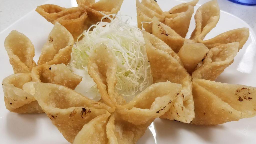 Crab Rangoon - Hoành Thánh Chiên · Stuffed with combination of cheese, crab meat and wrapped with wonton skins served with sweet and sour sauce.