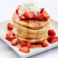 Strawberry Pancakes · A stack of 3 fluffy pancakes topped with locally grown sliced strawberries then dusted with ...