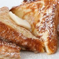 French Toast · Scrumptious French toast dusted with powdered sugar and a side of syrup.