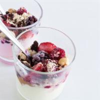 Yogurt Parfait · Fresh yogurt with layers of locally grown fruit and topped with granola.