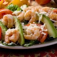 Shrimp And Avocado Salad · Fresh romaine topped with shrimp, fresh avocado slices, tomatoes and Monterey jack cheese. D...