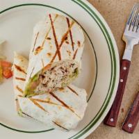 Mexican Chicken Wrap · Char-grilled strips of marinated chicken, pico de gallo, shredded cheese and guacamole in fl...