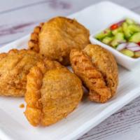 Chicken Curry Puffs · Puff pastry stuff with ground chicken, sweet potatoes, red potatoes, onions and aroma of cur...