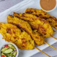 Chicken Satay · Grilled chicken tender marinated with Thai herbs, coconut milk on skewers served with peanut...