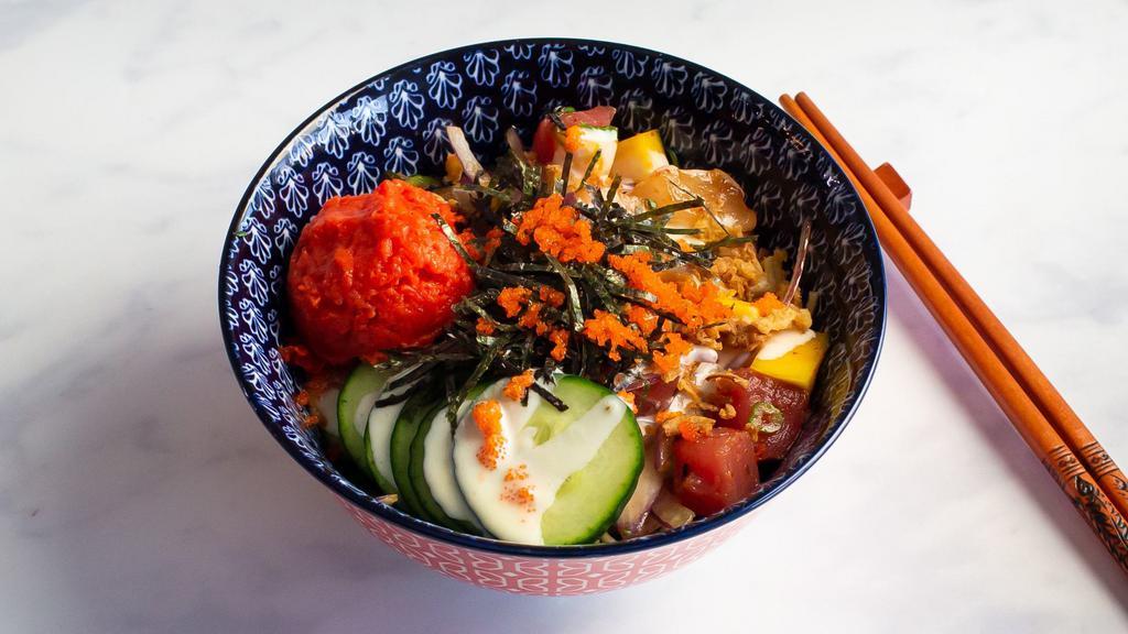 Salmon Lover · Salmon, spicy salmon, mango, cucumber, green onion, sweet onion. Mixed with poke sauce. Topped with creamy mayo, masago, onion crisps, and shredded nori.