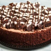 Brownie Fudge (10'') · A dense chocolate cake nestled between chocolate pudding and chocolate mousse topped with ch...
