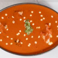 Chicken Makhni · Chicken pieces roasted in a clay oven and then folded into a spiced.